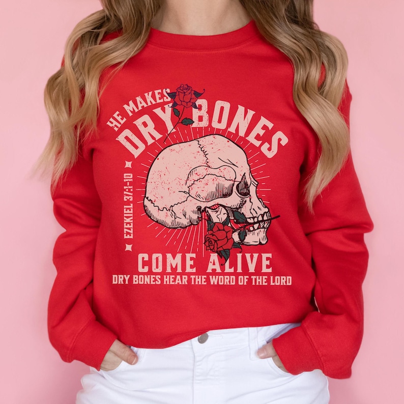 May include: Red sweatshirt with a skull graphic and the text "He makes dry bones come alive Ezekiel 37:1-10 Dry bones hear the word of the Lord".