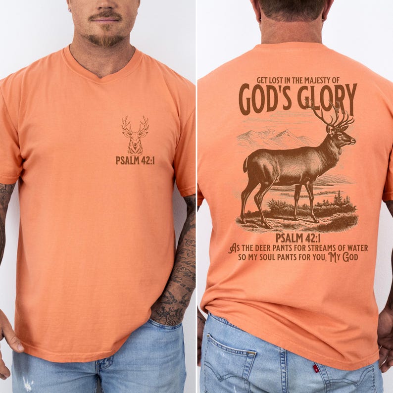 A bright orange t-shirt with a brown deer silhouette and the text 'PSALM 42:1' on the front. The back of the shirt has a brown deer illustration with the text 'GET LOST IN THE MAJESTY OF GOD'S GLORY'. Mens Christian Shirts, Bible Verse Shirt, Hunting Gifts, Husband Gift, Deer Hunter, Father's Day Gift, Jesus Shirt, Adult Baptism Gifts, Men's Shirt, Religious Shirt, Christian Gift, Religious Gift For Men, Hunting T-shirt, Deer Tshirt, Comfort Colors Tshirt