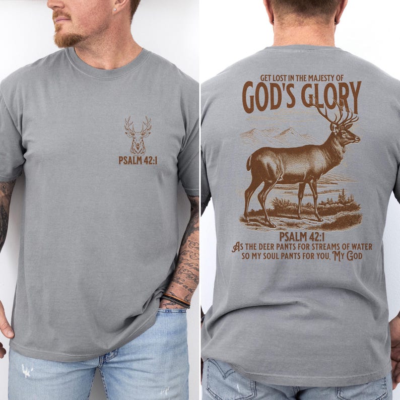 A gray t-shirt with a brown deer silhouette and the text 'PSALM 42:1' on the front. On the back the text 'GET LOST IN THE MAJESTY OF GOD'S GLORY' and a brown deer silhouette. Mens Christian Shirts, Bible Verse Shirt, Hunting Gifts, Husband Gift, Deer Hunter, Father's Day Gift, Jesus Shirt, Adult Baptism Gifts, Men's Shirt, Religious Shirt, Christian Gift, Religious Gift For Men, Hunting T-shirt, Deer Tshirt, Comfort Colors Tshirt