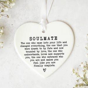 a heart-shaped ornament with a message about love and relationships.