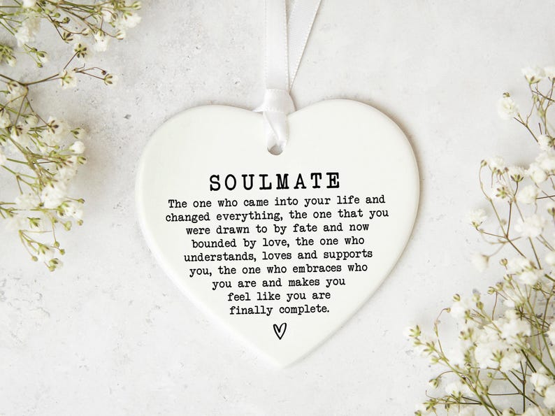 a heart-shaped ornament with a message about love and relationships.