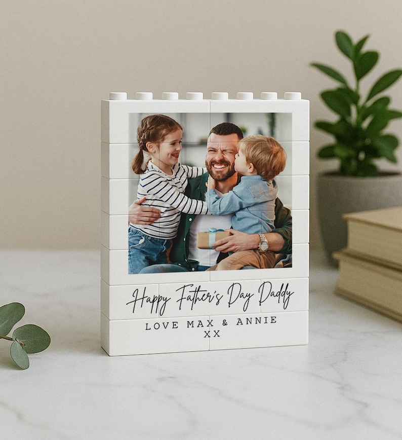 May include: White Lego-style photo block with a photo of a father and two children. The text "Happy Father's Day Daddy Love Max & Annie XX" is printed on the bottom of the block.