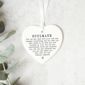 a heart-shaped ornament with a message about love and relationships.