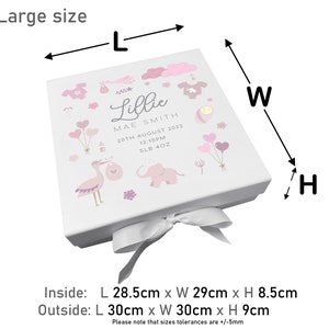 May include: A white gift box with a pink and white design featuring a stork, elephant, and balloons. The box is tied with a white satin ribbon and has the text "Lillie Mae Smith 20th August 2022 12:15PM 5LB 4OZ" printed on the front. The box measures 28.5 cm x 29 cm x 8.5 cm inside and 30 cm x 30 cm x 9 cm outside.