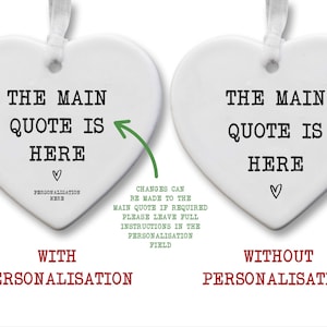 two heart-shaped ornaments with the text "THE MAIN QUOTE IS HERE" written on them. One ornament is personalized with the text "THE MAIN QUOTE IS HERE" and the other is without personalization. The text "WITH PERSONALISATION HERE" and "WITH PERSONALISATION HERE" are displayed below each ornament, indicating the difference between the two.