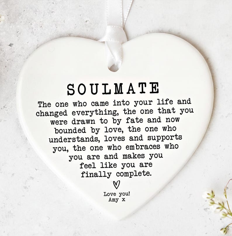 a heart-shaped ornament with a heartfelt message about the importance of love and support in a relationship.