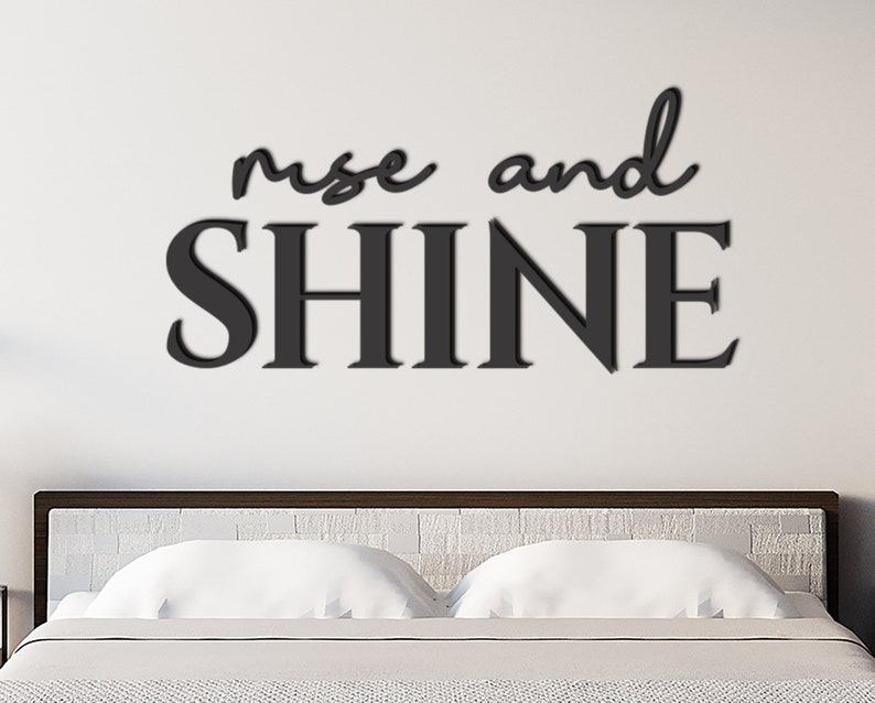 May include: Black and white wall art with the text "rise and shine" in a modern font.