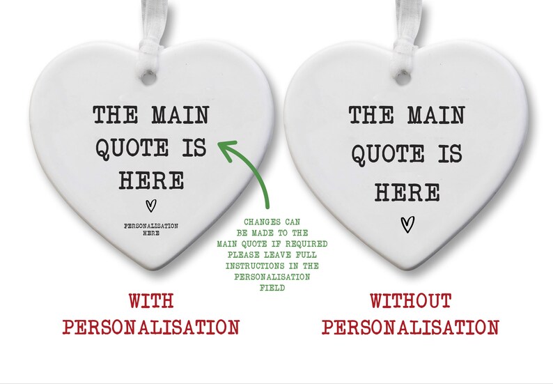 May include: Two white heart-shaped ornaments with text. One says "THE MAIN QUOTE IS HERE" with a heart and "PERSONALISATION HERE". The other says the same without the personalization. Both have a ribbon for hanging.