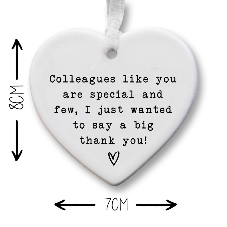 The image is a heart-shaped ornament with a message that says "Colleagues like you are special and few, I just wanted to say a big thank you!" The ornament is approximately 7 centimeters in size.