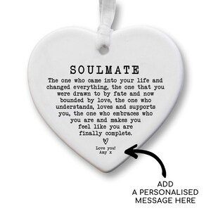 a heart-shaped ornament with a message written on it. The message is a romantic and affectionate message that expresses love and appreciation for the person who received it. The ornament is personalized with a message that adds a personal touch to the gift.