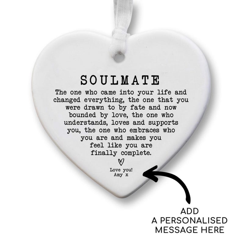 a heart-shaped ornament with a message written on it. The message is a romantic and affectionate message that expresses love and appreciation for the person who received it. The ornament is personalized with a message that adds a personal touch to the gift.