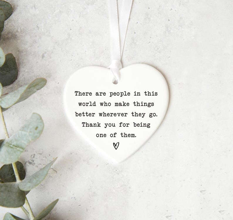 a heart-shaped ornament with a message about appreciating people who make things better, along with a heart symbol.