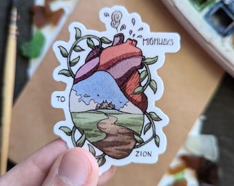 May include: A sticker with a heart-shaped design featuring a stylized landscape with a winding path leading to a castle. The heart is surrounded by vines and the text "HIGHWAYS TO ZION" is printed on the sticker.
