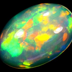 May include: A polished, oval-shaped opal gemstone. The opal displays a vibrant play-of-color, with flashes of green, yellow, orange, and blue. The gemstone is set against a black background, highlighting its iridescent qualities.