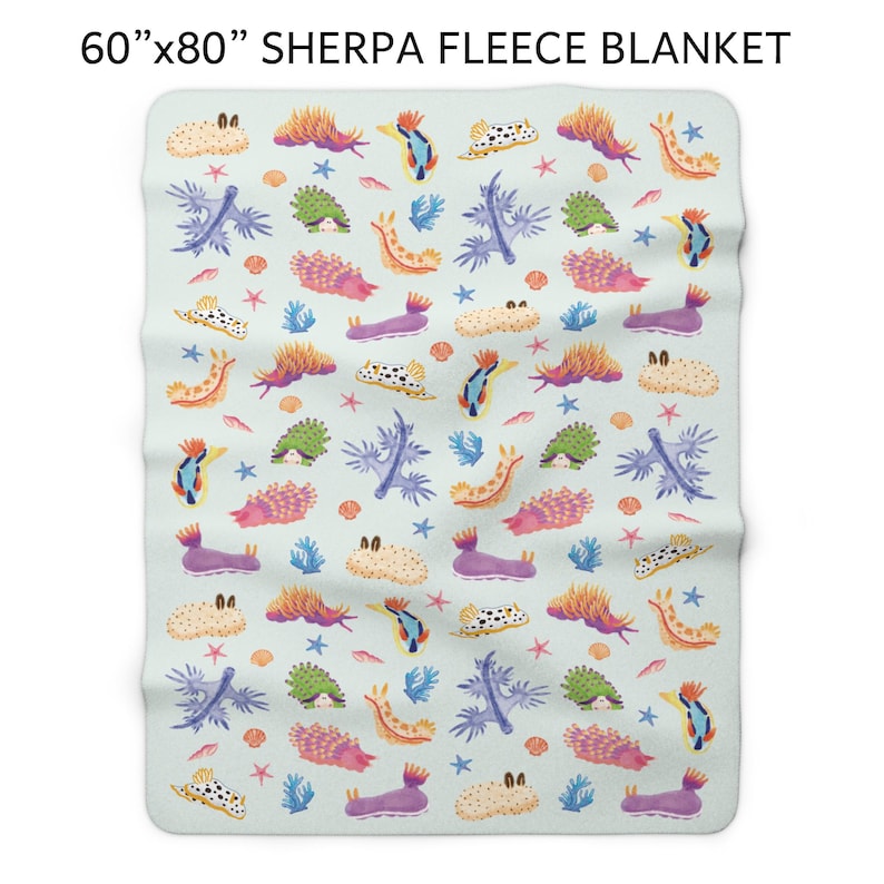 May include: Sherpa fleece blanket, 60" x 80", featuring a repeating pattern of colorful sea slugs, coral, and starfish on a light blue background. The blanket's design includes various shades of orange, purple, green, and blue, creating a vibrant and whimsical aesthetic.