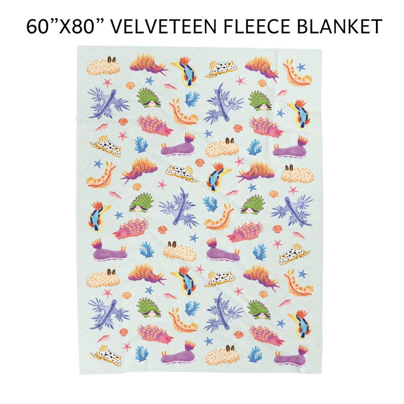 May include: A 60" x 80" velveeteen fleece blanket. The blanket features a repeating pattern of colorful sea creatures, coral, and starfish on a light blue background. The design includes orange, purple, green, and blue elements.