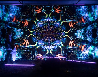 May include: A large, colorful tapestry with a psychedelic, kaleidoscope design. The tapestry features a central mandala with intricate patterns in shades of blue, green, yellow, and orange. The tapestry is illuminated by purple lights.