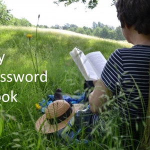 May include: A person sitting in a grassy field reading a book with the text "My Password Book" in the foreground.