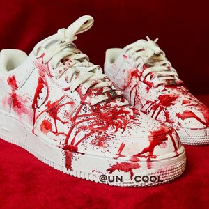 Nike blood splatter shoes best sale