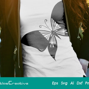 May include: A black and white butterfly graphic design on a white t-shirt. The butterfly is stylized and has a geometric pattern.