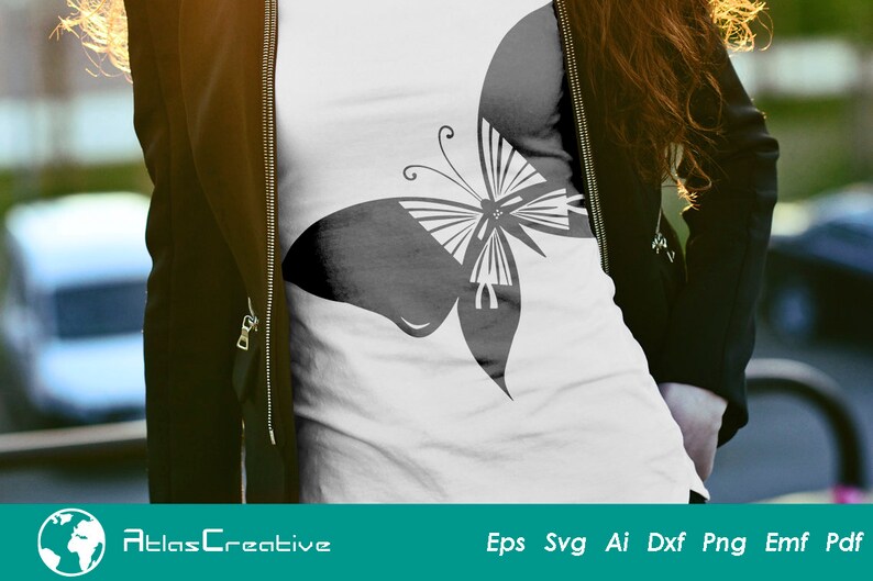 May include: A black and white butterfly graphic design on a white t-shirt. The butterfly is stylized and has a geometric pattern.