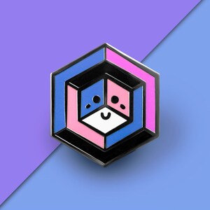 May include: A black, blue, and pink enamel pin with a geometric design. The pin features a smiling face in the center.