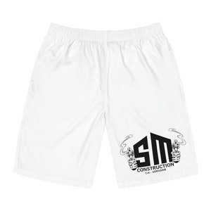 May include: White athletic shorts with a black logo that says "SM CONSTRUCTION Lic. 1091048". The logo features a stylized "SM" with two pistols and smoke coming from the barrels.