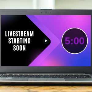 May include: A laptop screen displaying a countdown timer with a purple and blue gradient background. The timer shows 5:00 and the text "LIVESTREAM STARTING SOON".