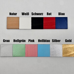 May include: A color chart with 10 different wood samples painted in various colors, including natural wood, white, black, red, blue, gray, light green, pink, light blue, silver, and gold.