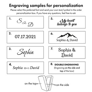 May include: Image showcasing engraving samples for personalization. The image displays various text and symbol options, including names, dates, and phrases like "My heart belongs to you." It also indicates double engraving options on the side and top of a box.