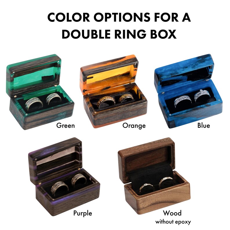 May include: Five rectangular double ring boxes with hinged lids, labeled COLOR OPTIONS FOR A DOUBLE RING BOX. Four boxes feature wood and colored resin in green, orange, blue, and purple. One box is solid wood without epoxy. Each contains two rings.