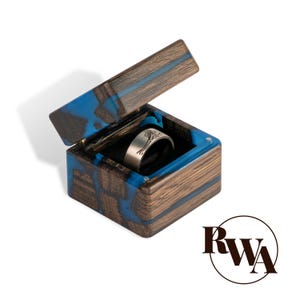 MUSE – Blue resin & black wood proposal ring box. Unique epoxy engagement ring box. Personalized engraved ring box from Bog oak