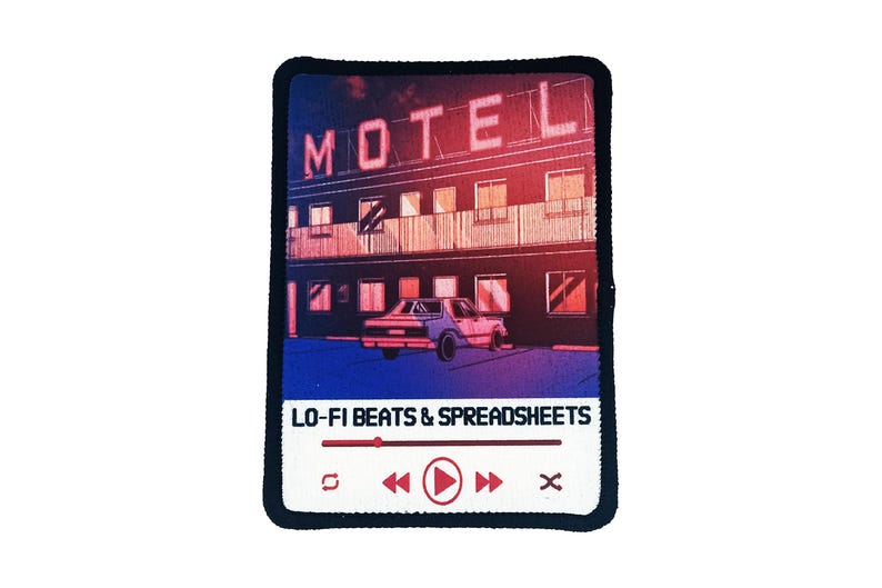 Custom rectangle iron-on patch with detailed motel artwork and “Lo-Fi Beats & Spreadsheets” printed in full color.