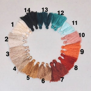 May include: A color chart of 14 different tassel colors, numbered 1 through 14. The colors are: off-white, beige, light brown, gold, tan, light brown, red, orange, pink, light blue, teal, dark teal, dark green, and black.