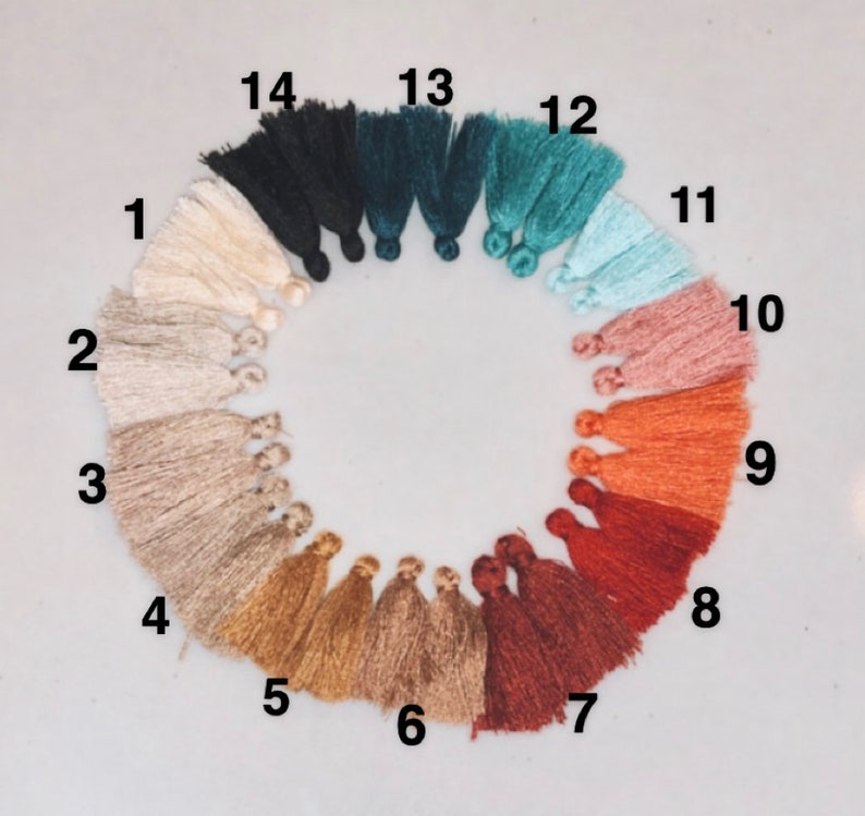 May include: A color chart of 14 different tassel colors, numbered 1 through 14. The colors are: off-white, beige, light brown, gold, tan, light brown, red, orange, pink, light blue, teal, dark teal, dark green, and black.