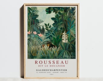 May include: A framed print of a painting by Henri Rousseau, titled "The Jungle". The painting depicts a lush green jungle scene with pink flowers, white flowers, and a black panther. The text "ROUSSEAU DIT LE DOUANIER GALERIE CHARPENTIER 76, FAUBOURG SAINT-HONORE - PARIS VII 1961" is printed below the painting.