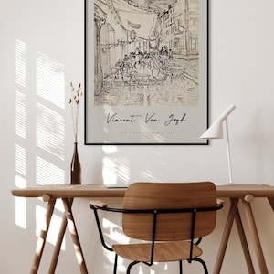 May include: A black and white line drawing of a cafe terrace at night by Vincent Van Gogh. The drawing depicts a street scene with tables and chairs, and people sitting outside the cafe. The text "Vincent Van Gogh" and "Cafe Terrace at Night - 1888" is printed below the drawing.
