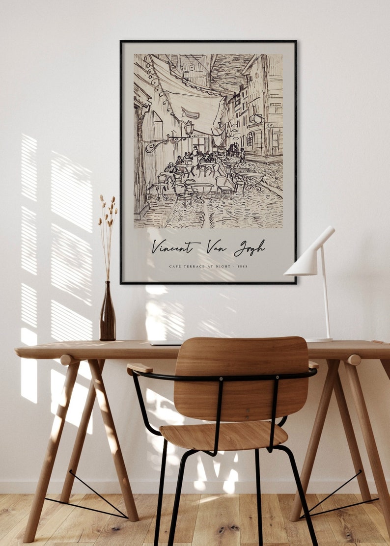 May include: A black and white line drawing of a cafe terrace at night by Vincent Van Gogh. The drawing depicts a street scene with tables and chairs, and people sitting outside the cafe. The text "Vincent Van Gogh" and "Cafe Terrace at Night - 1888" is printed below the drawing.