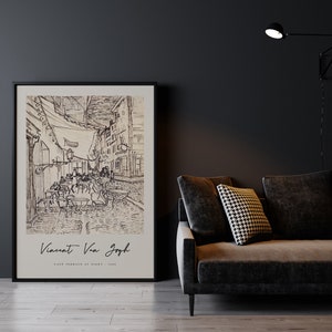 May include: A black and white sketch of a cafe terrace at night by Vincent van Gogh. The sketch shows a street lined with buildings and tables with people sitting at them. The cafe is lit by a single lamppost.
