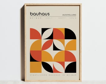 May include: A minimalist poster with a geometric design in black, orange, and yellow. The poster has the text "bauhaus" in bold, "WEIMAR. JULI. - SEPT. 1923" and "STAATLICHEM BAUHAUS IN WEIMAR" in smaller font.
