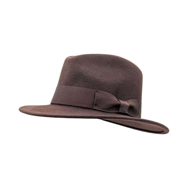 Fedora hat

Classic fedora

Men’s fedora hat

Indiana Jones fedora

1940s fedora hat

Retro fedora hat

Material & build

Wool fedora hat

Crushable fedora

Packable fedora hat

Soft wool felt fedora

Style & details

Vintage fedora

Wide brim fedora

Pinch crown fedora

Grosgrain band fedora

Classic ribbon band hat

Use & occasions

Travel fedora

Outdoor fedora hat

Everyday fedora

Film-inspired fedora