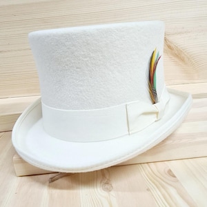 May include: A white top hat with a white ribbon and a small colourful feather accent.