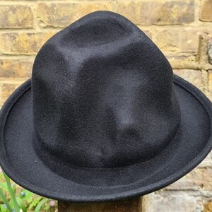 Handmade wool hat

Mountain hat

Top hat oversized

Pharrell Williams style hat

Secondary Keywords

Premium wool hat

Statement fashion hat

Unisex oversized hat

Artistic tall hat


Oversized odd shaped tall wool hat

Handmade premium wool mountain hat

Black oversized top hat

Navy tall fashion hat

One size wool statement hat

Pharrell inspired mountain hat

Marketplace / Hashtags (optional)

#OversizedHat

#MountainHat

#WoolHat

#StatementHat

#HandmadeHat

#FashionHat

#UnisexStyle