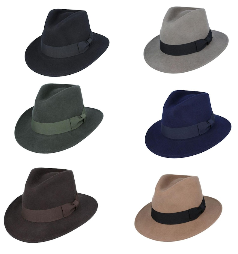 May include: Six fedora hats in different colors: black, gray, green, navy blue, brown, and beige. Each hat has a black ribbon around the crown.