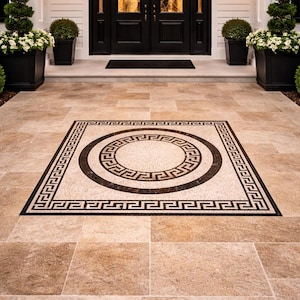 May include: Exterior view of a home's entrance featuring a black double door, flanked by symmetrical planters with topiaries and flowers. The walkway has a decorative tile inlay with a Greek key design.