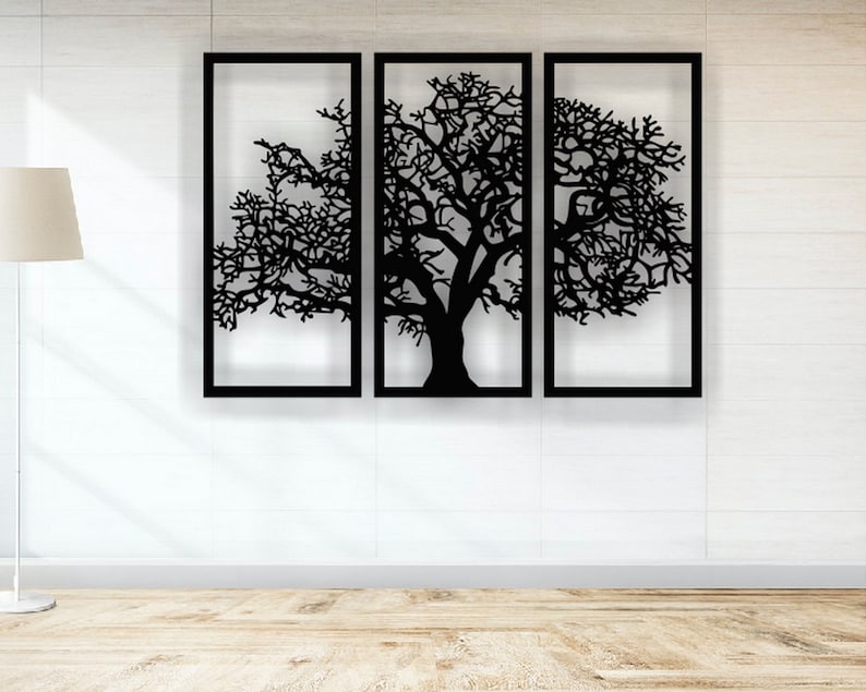 May include: Black metal wall art featuring a stylized tree with branches extending to the sides. The tree is divided into three sections, each framed in black.