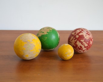 Four old wooden balls vintage red green yellow