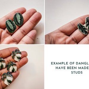 May include: Close-up of two pairs of earrings featuring green and white leaf designs. The earrings are shown on a hand, with the text "EXAMPLE OF DANGLES THAT HAVE BEEN MADE INTO STUDS" below the image.