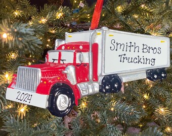 May include: Red and white semi-truck Christmas ornament with the text "Smith Bros Trucking" on the side and "2024" on the front.