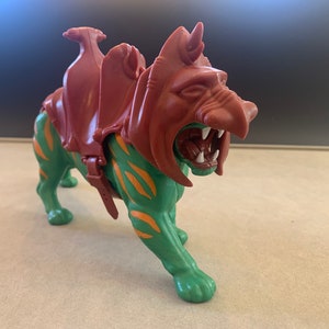 Vintage Masters of the Universe Battle Cat Action Figure with saddle and helmet.